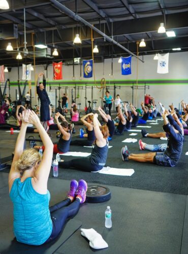 people doing yoga inside gym